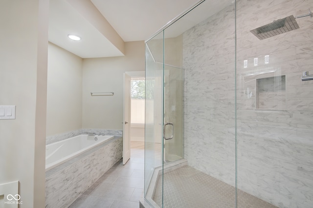 bathroom featuring shower with separate bathtub and tile patterned floors