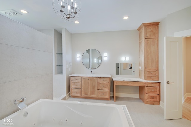 full bath with a jetted tub, vanity, and recessed lighting