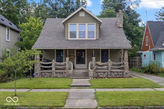 view of front facade with a porch and a front yard