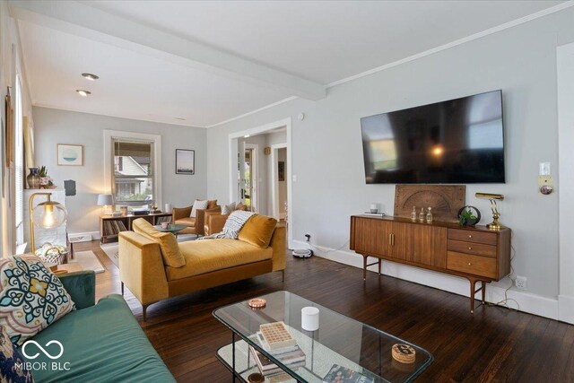 living room featuring beamed ceiling and hardwood / wood-style floors