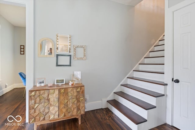 stairway featuring dark hardwood / wood-style floors