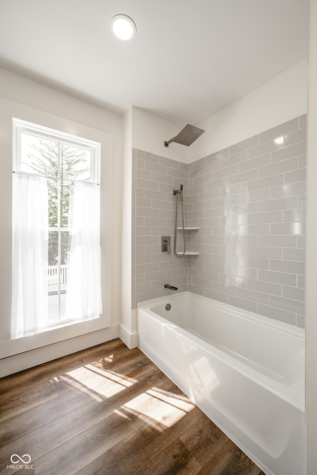 bathroom with wood-type flooring and shower / tub combo with curtain