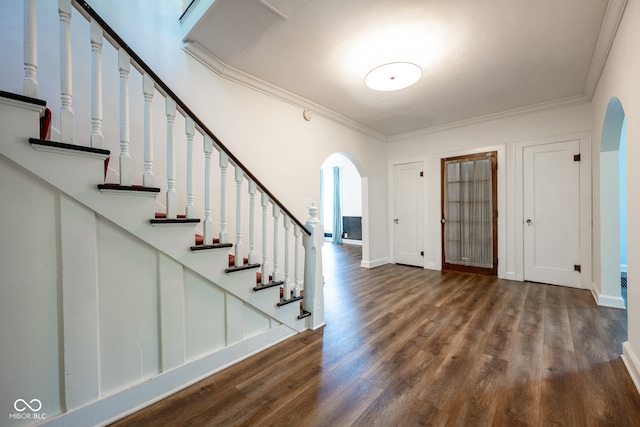 entrance foyer featuring hardwood / wood-style flooring and ornamental molding