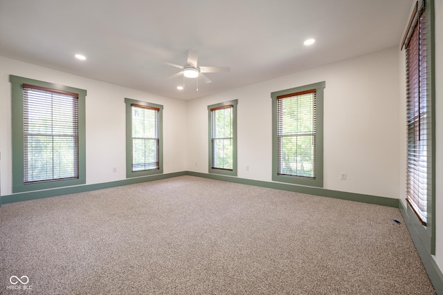 unfurnished room with recessed lighting, carpet flooring, and baseboards