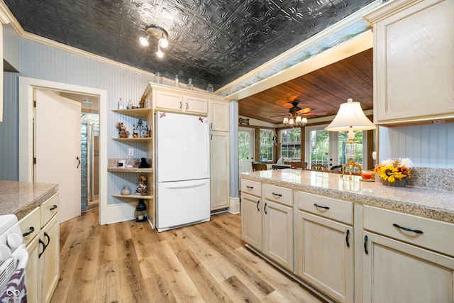 kitchen with light hardwood / wood-style floors, lofted ceiling, white appliances, ornamental molding, and ceiling fan