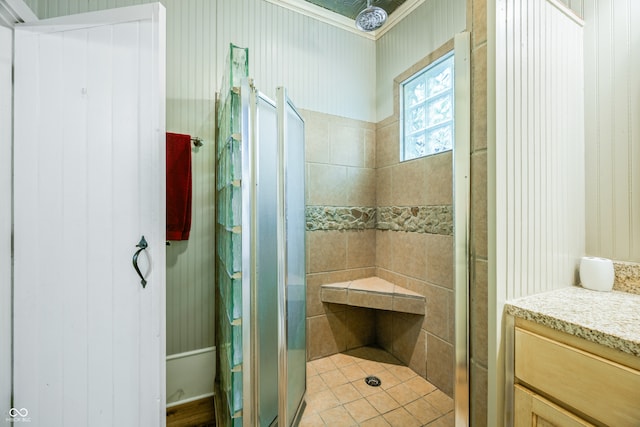 bathroom with vanity and a shower with shower door