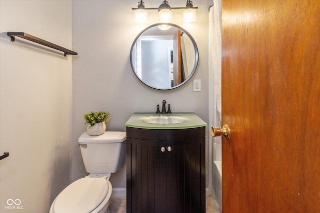 bathroom featuring tile patterned flooring, vanity, and toilet