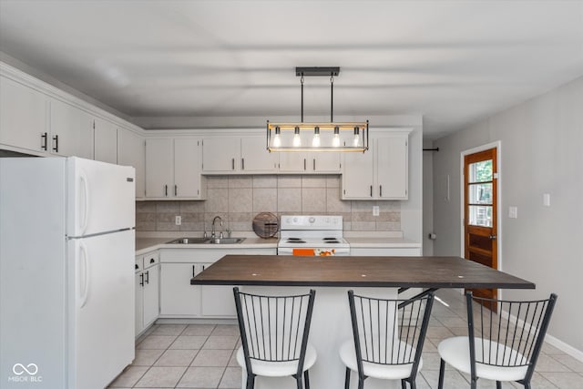 kitchen with light tile patterned flooring, sink, white appliances, and white cabinetry