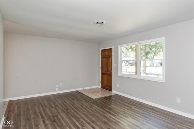 spare room with hardwood / wood-style flooring