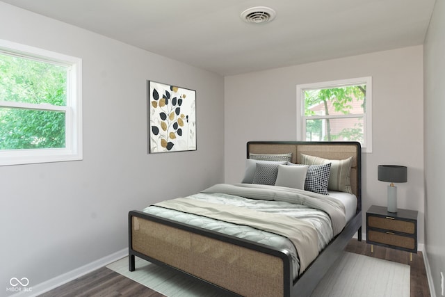 bedroom with wood-type flooring