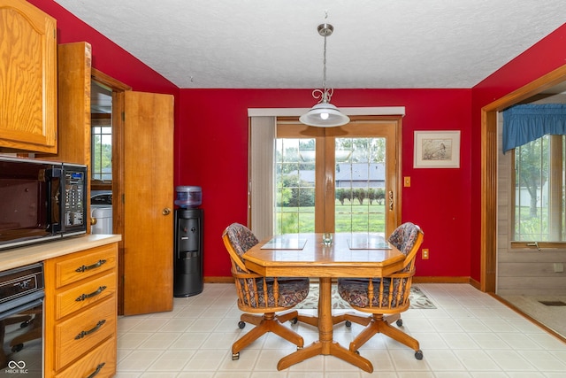 dining area with a textured ceiling