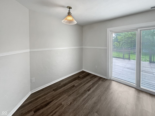 unfurnished room with wood-type flooring