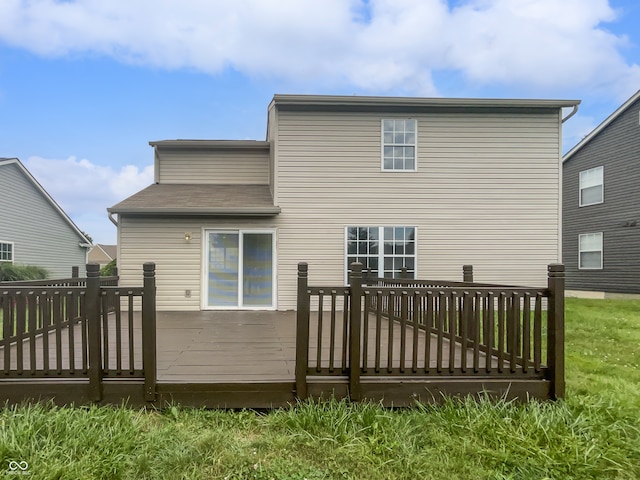 back of house featuring a wooden deck