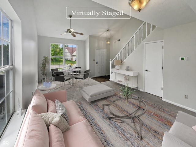 living room with hardwood / wood-style floors and ceiling fan