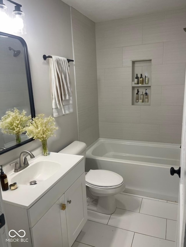 full bathroom with vanity, tiled shower / bath combo, and toilet