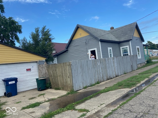 view of side of property featuring a garage