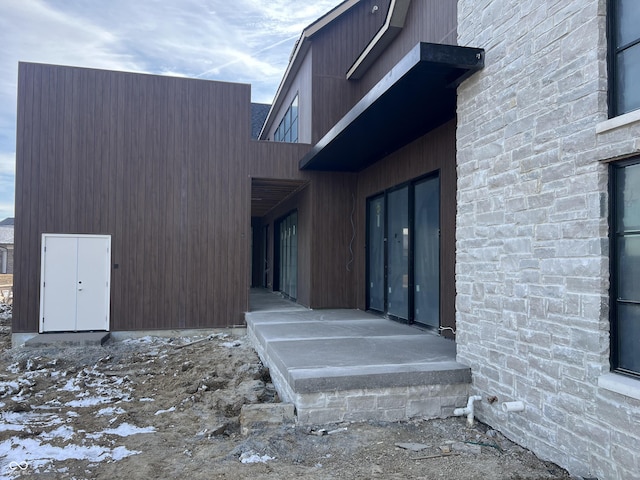 view of snow covered property entrance