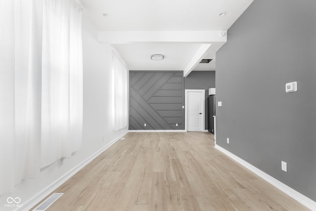 spare room featuring light hardwood / wood-style flooring