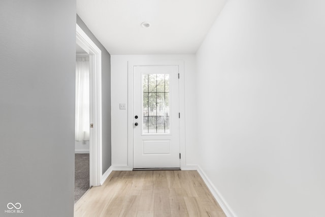 doorway to outside with light wood-type flooring