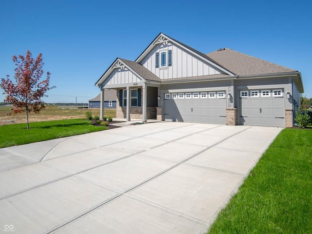 craftsman-style house featuring a garage and a front lawn