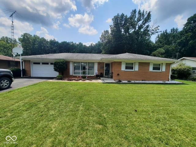 ranch-style home with a garage and a front lawn