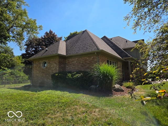 view of property exterior with a lawn