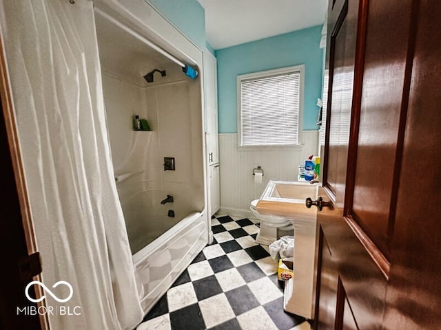 bathroom with toilet, shower / bath combination with curtain, and tile patterned flooring