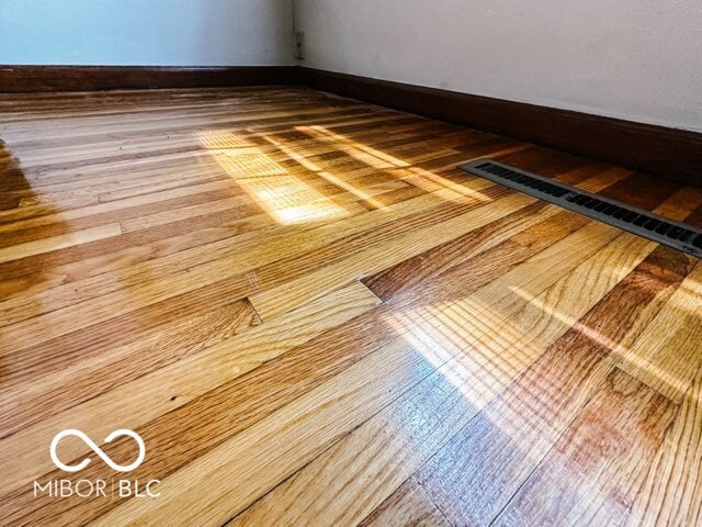 details featuring wood-type flooring