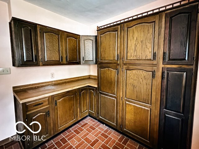 kitchen with dark brown cabinetry