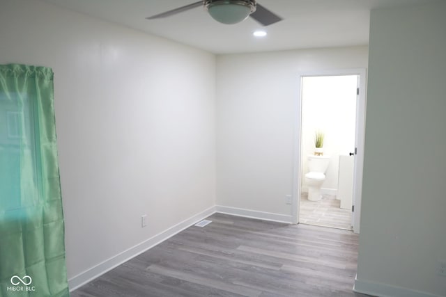 unfurnished room with wood-type flooring and ceiling fan