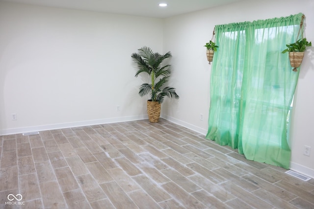 unfurnished room featuring light wood-type flooring