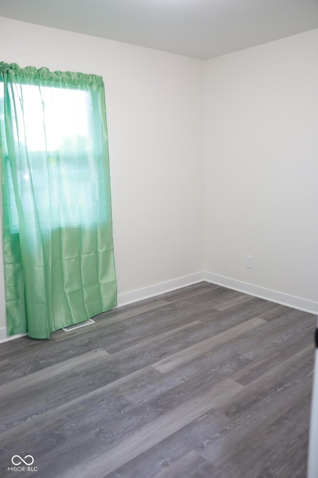 empty room featuring dark hardwood / wood-style floors