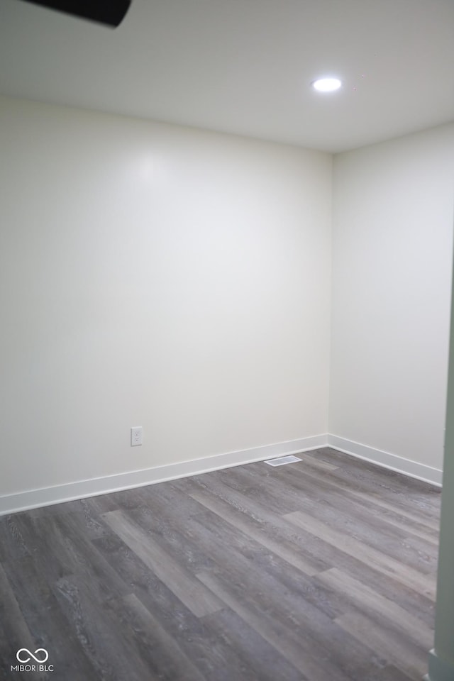 empty room with dark hardwood / wood-style floors