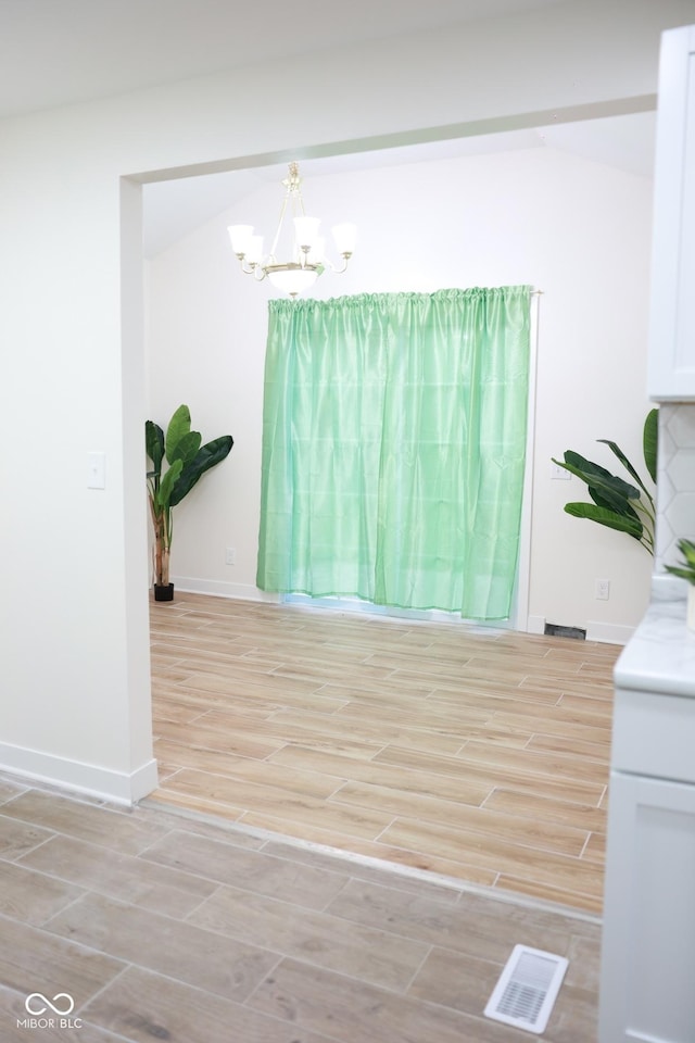 interior space with a notable chandelier