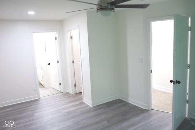 spare room with hardwood / wood-style flooring and ceiling fan