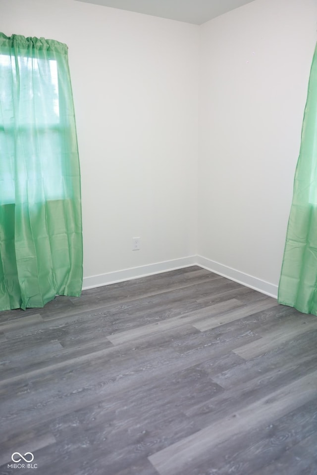 empty room featuring dark hardwood / wood-style flooring