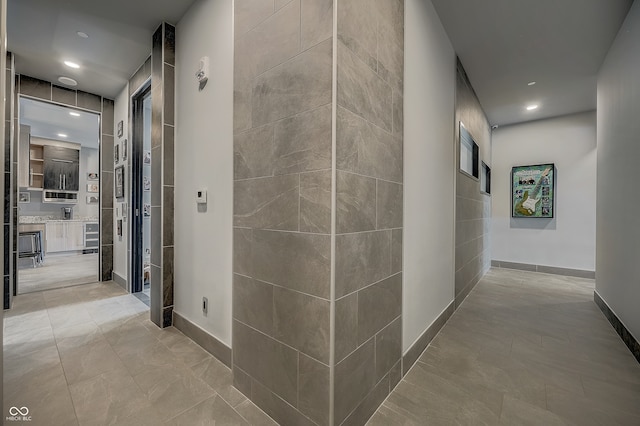 hallway featuring light tile patterned flooring