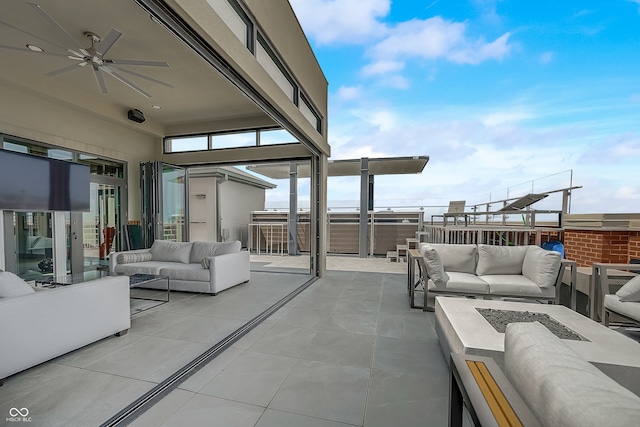 view of patio / terrace featuring an outdoor living space and ceiling fan