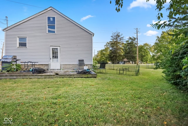 exterior space with a lawn and a wooden deck