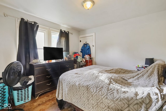 bedroom with wood-type flooring