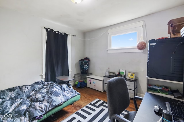 bedroom featuring dark hardwood / wood-style flooring