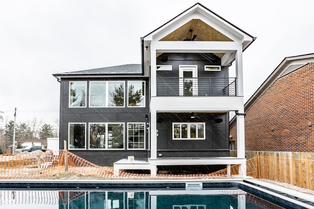 rear view of property with a balcony