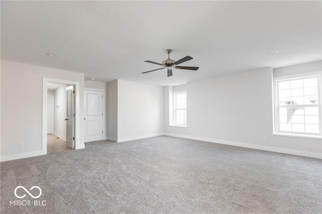 carpeted empty room with ceiling fan