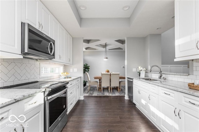 kitchen featuring white cabinetry, tasteful backsplash, stainless steel appliances, sink, and dark hardwood / wood-style floors