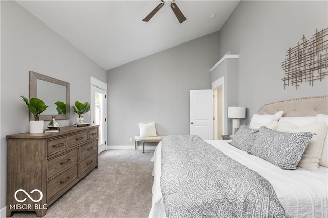 carpeted bedroom with high vaulted ceiling and ceiling fan