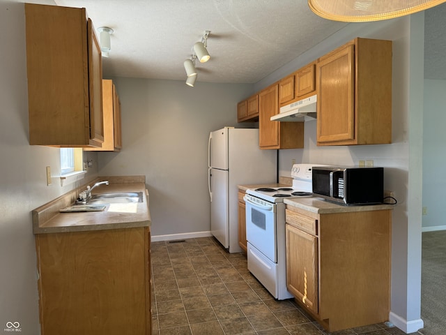 kitchen with track lighting, white electric range, sink, and a textured ceiling