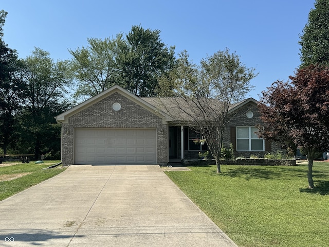 ranch-style house featuring a garage and a front yard