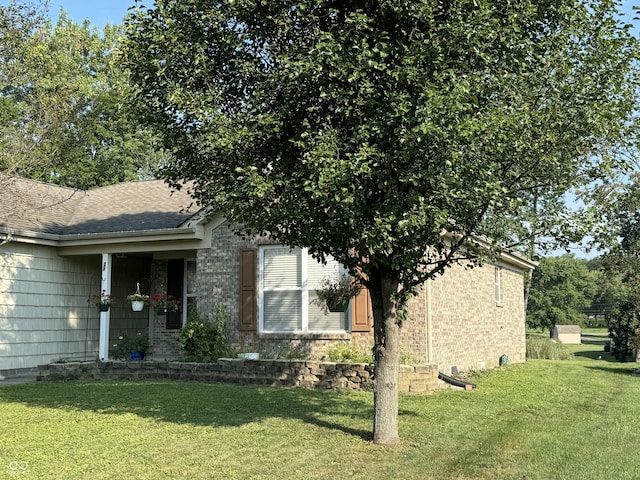 view of home's exterior with a lawn