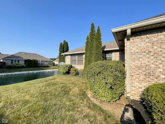 view of yard with a water view