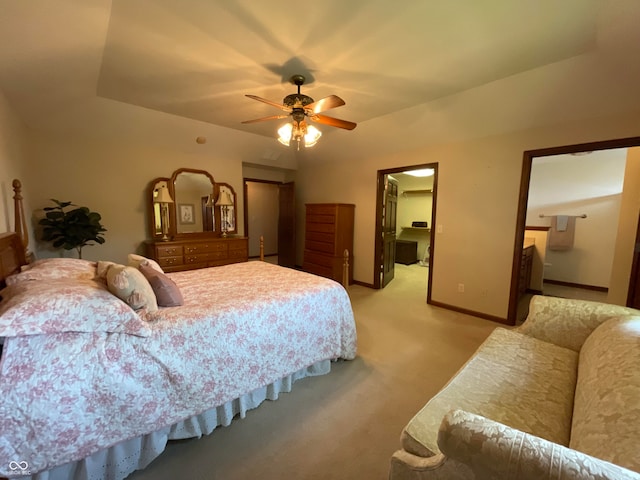 carpeted bedroom with ceiling fan and ensuite bathroom